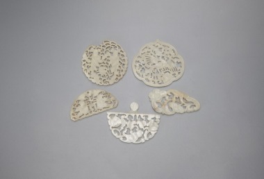 A Group Of Five Chinese White Jade Ornaments.