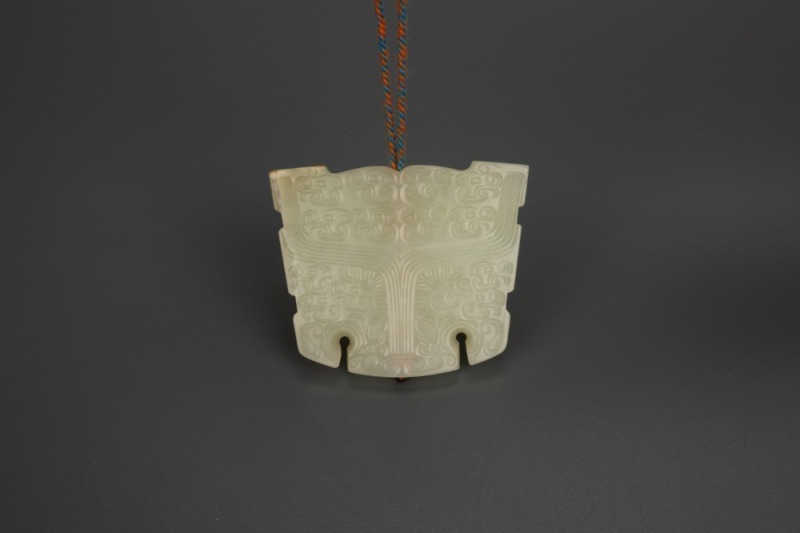 A White Jade Carved &lsquo;Beast&rsquo; Pendant