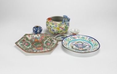 A Group Of Six Dishes And Jar