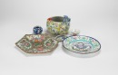 A Group Of Six Dishes And Jar