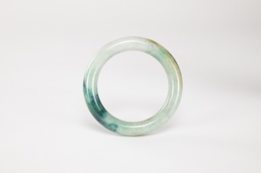 A Deep Green Jadeite Bangle.