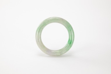 A Green Lavender Jadeite Bangle.