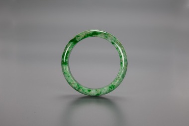 A Peas Green Jadeite Bangle.