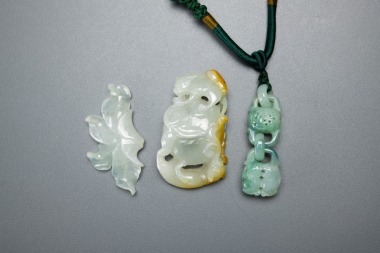 A Group Of Three Jadeite Pendants,