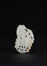 A Russet White Jade Carved &lsquo;Squirrels And Grape&rsquo; Pendant.