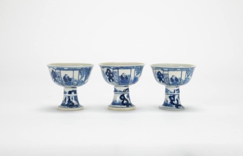 A Set Of Three Blue And White &lsquo;Figures And Landscape&rsquo; Stem Cups