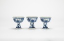 A Set Of Three Blue And White &lsquo;Figures And Landscape&rsquo; Stem Cups