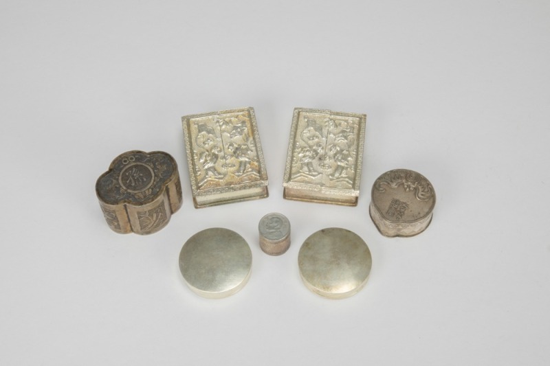 A Group of Seven Chased Silver Rouge Boxes,