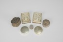 A Group of Seven Chased Silver Rouge Boxes,