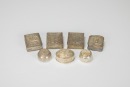 A Group of Seven Chased Silver Rouge Boxes,