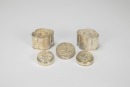 A Group of Five Chased Silver Rouge Boxes,