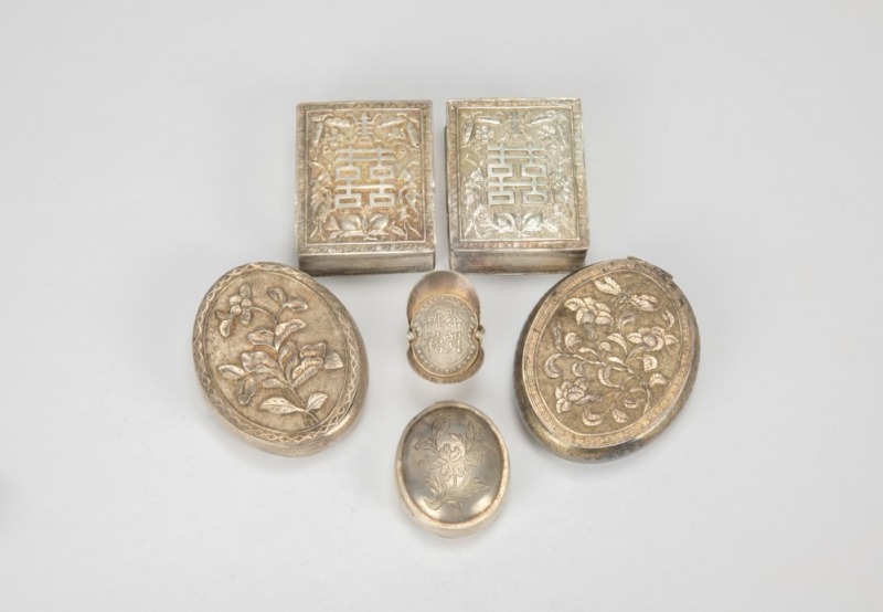 A Group of Six Chased Silver Rouge Boxes,
