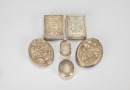 A Group of Six Chased Silver Rouge Boxes,