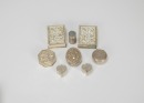 A Group of Eight Chased Silver Rouge Boxes,