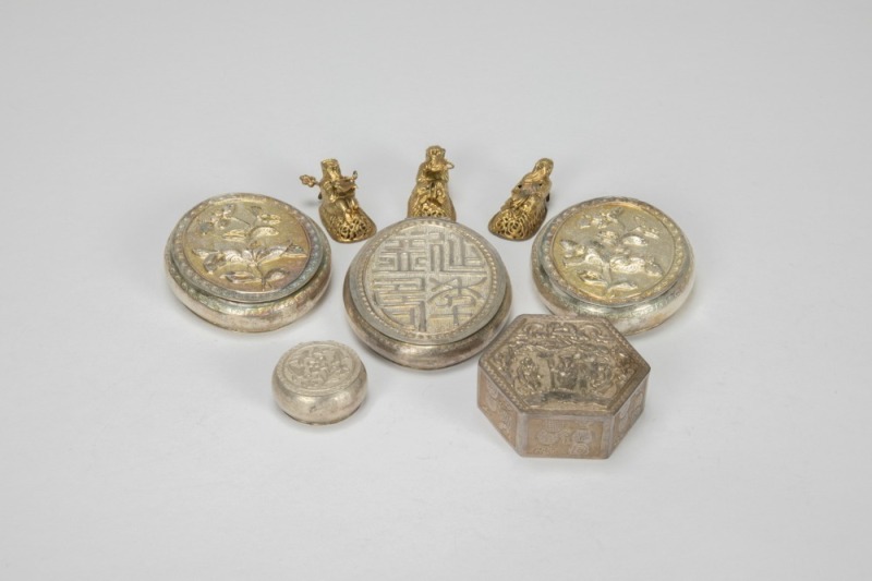 A Group of Eight Chased Silver Rouge Boxes And Gilt Metal Figures,