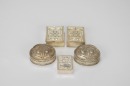 A Group of Five Chased Silver Rouge Boxes,