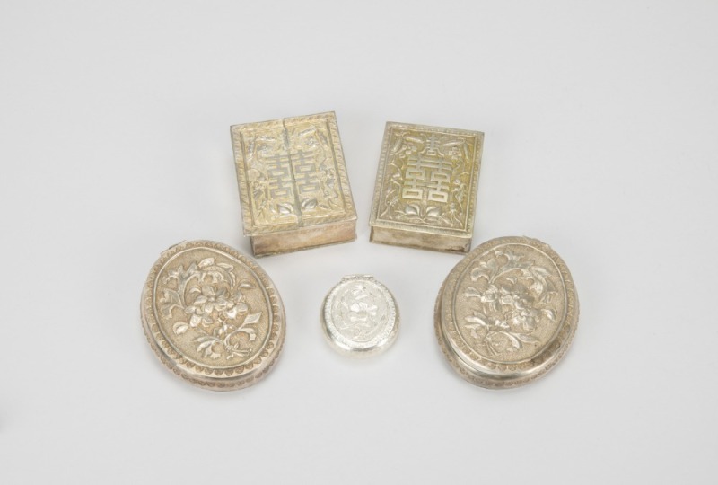 A Group of Five Chased Silver Rouge Boxes,