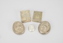 A Group of Five Chased Silver Rouge Boxes,