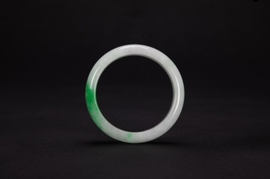 A Natural Green Jadeite Bangle