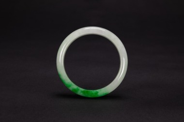 A Natural Green Jadeite Bangle