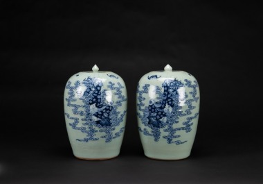 A Pair Of Green Ground Glazed Blue And White&rsquo; Figures&rsquo; Cover Jars.
