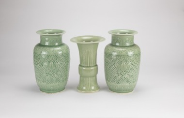 A Pair Of Light Green Glazed &lsquo;Flowers&rsquo; Vases And A Light Green &lsquo;Banana Leaf &rsquo; Vase