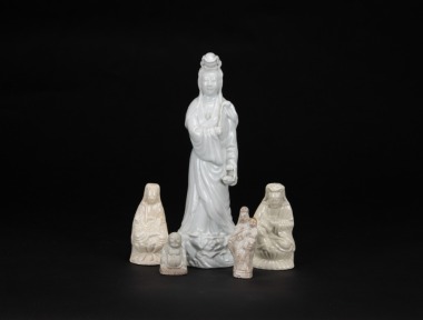 A Group Of Five White Glaze &lsquo;Guanyin And Buddha Stautes